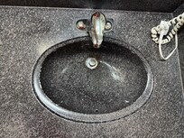 painted sink with the paint peeling