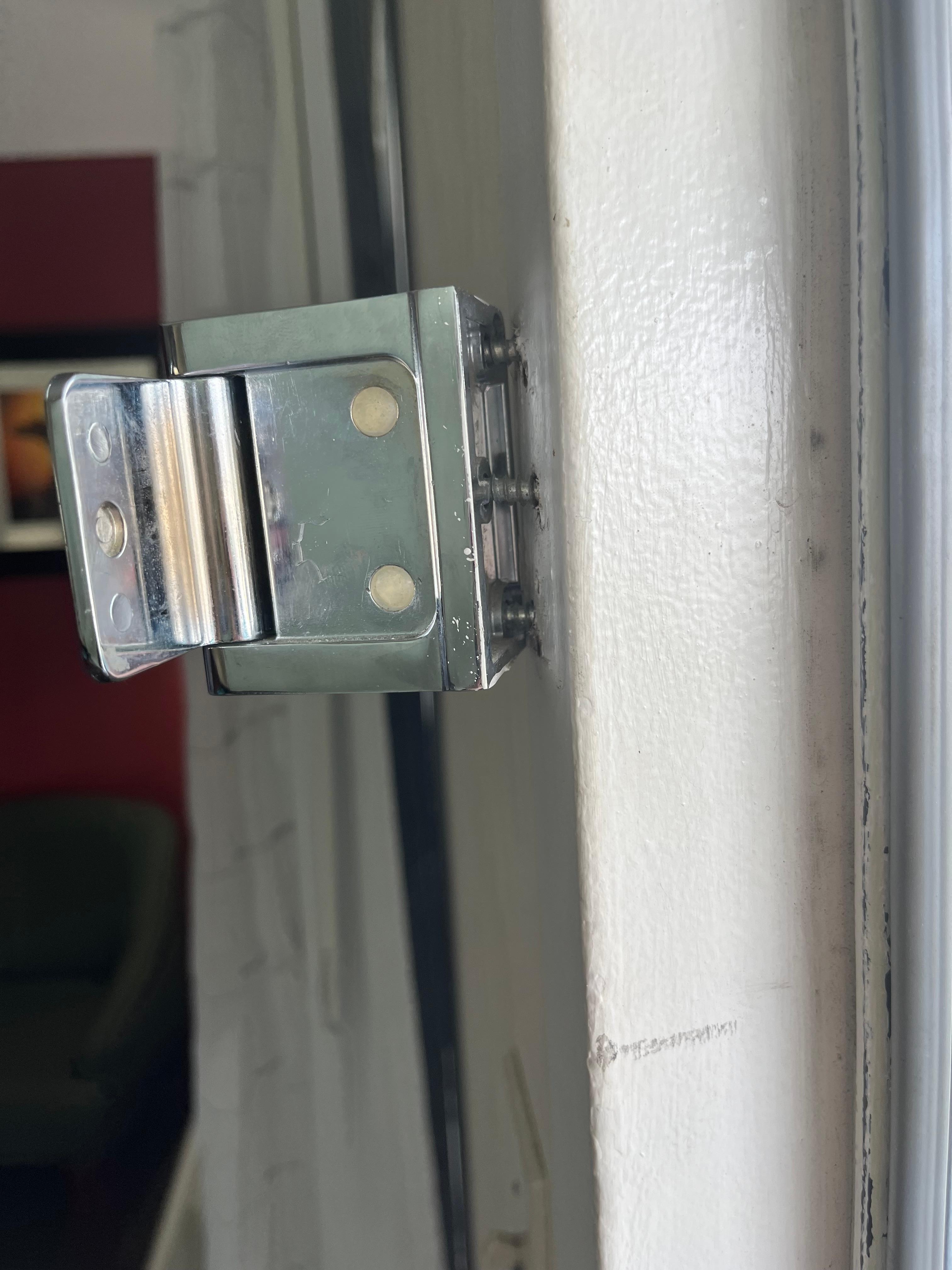 Security latch hanging off the door. Appeared to be forced entry at some point 