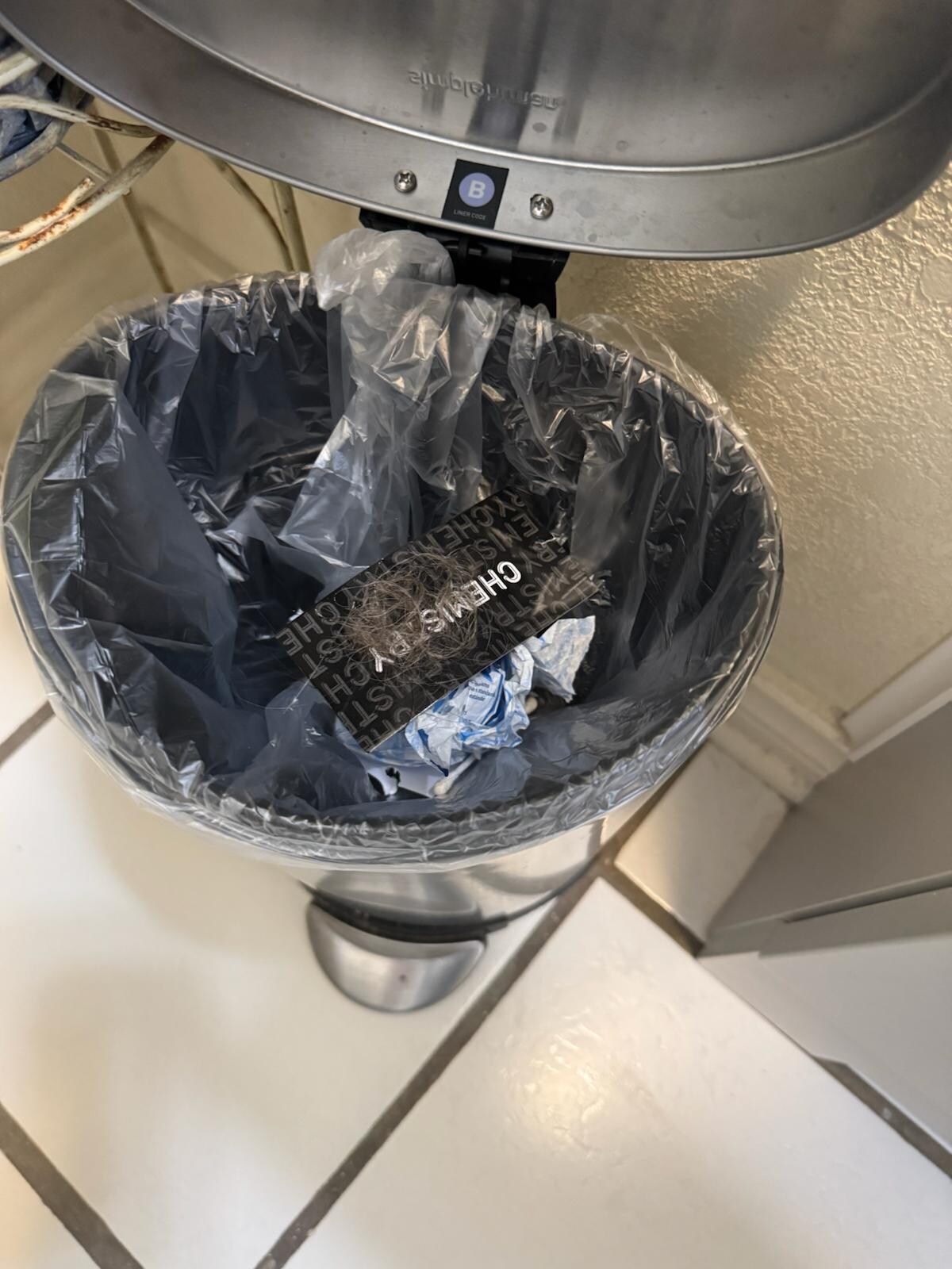 Trash can in bathroom