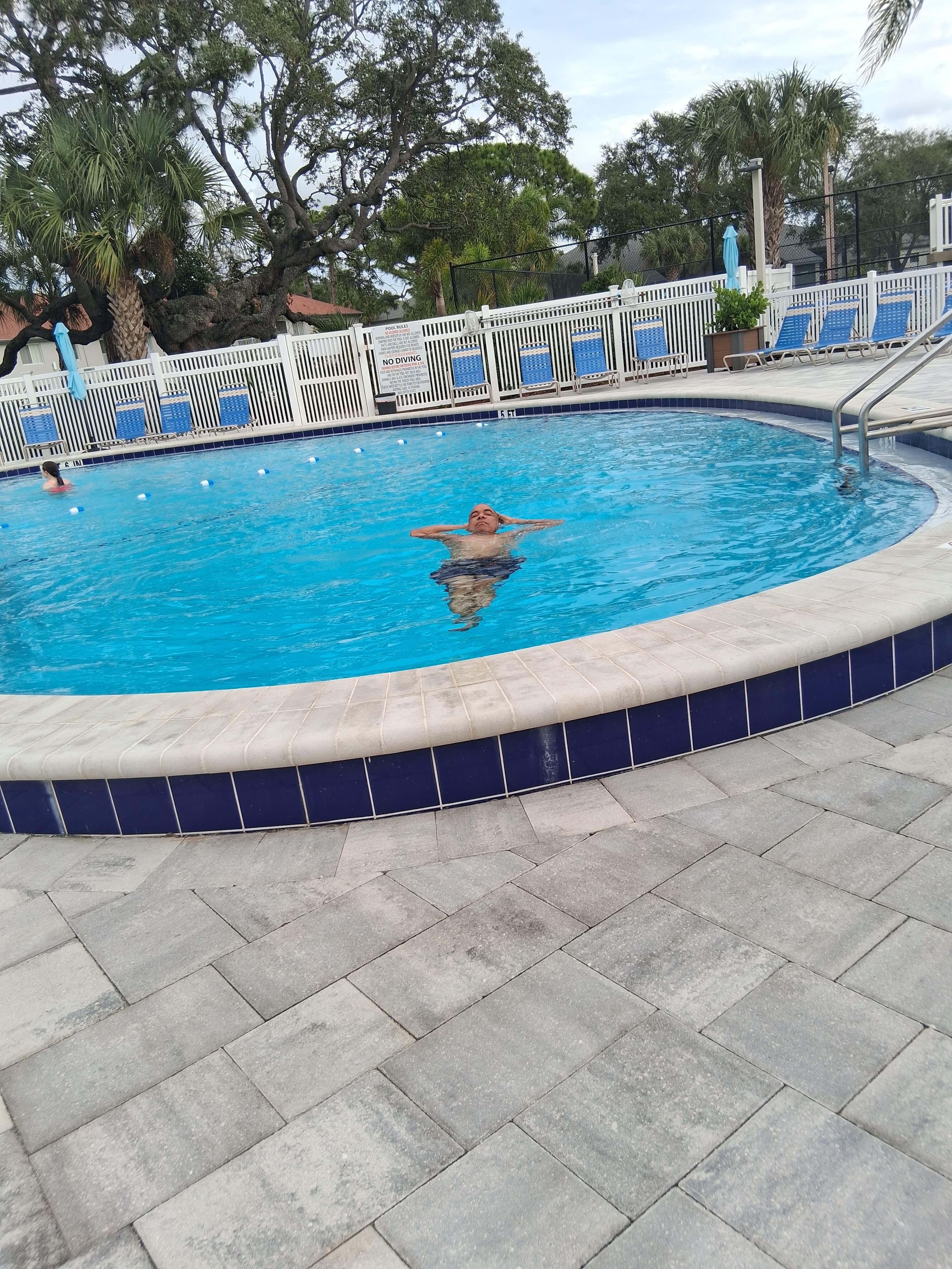  Husband is relaxing in the pool.