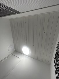 Holes in the ceiling and wall, wall hole covered by printer paper