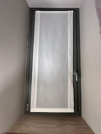 Windows were behind 2 layers of curtains, with additional privacy shade over glass