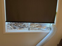 Foil covering the windows which donât shut