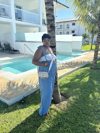 My mom infront the rooms with private pools