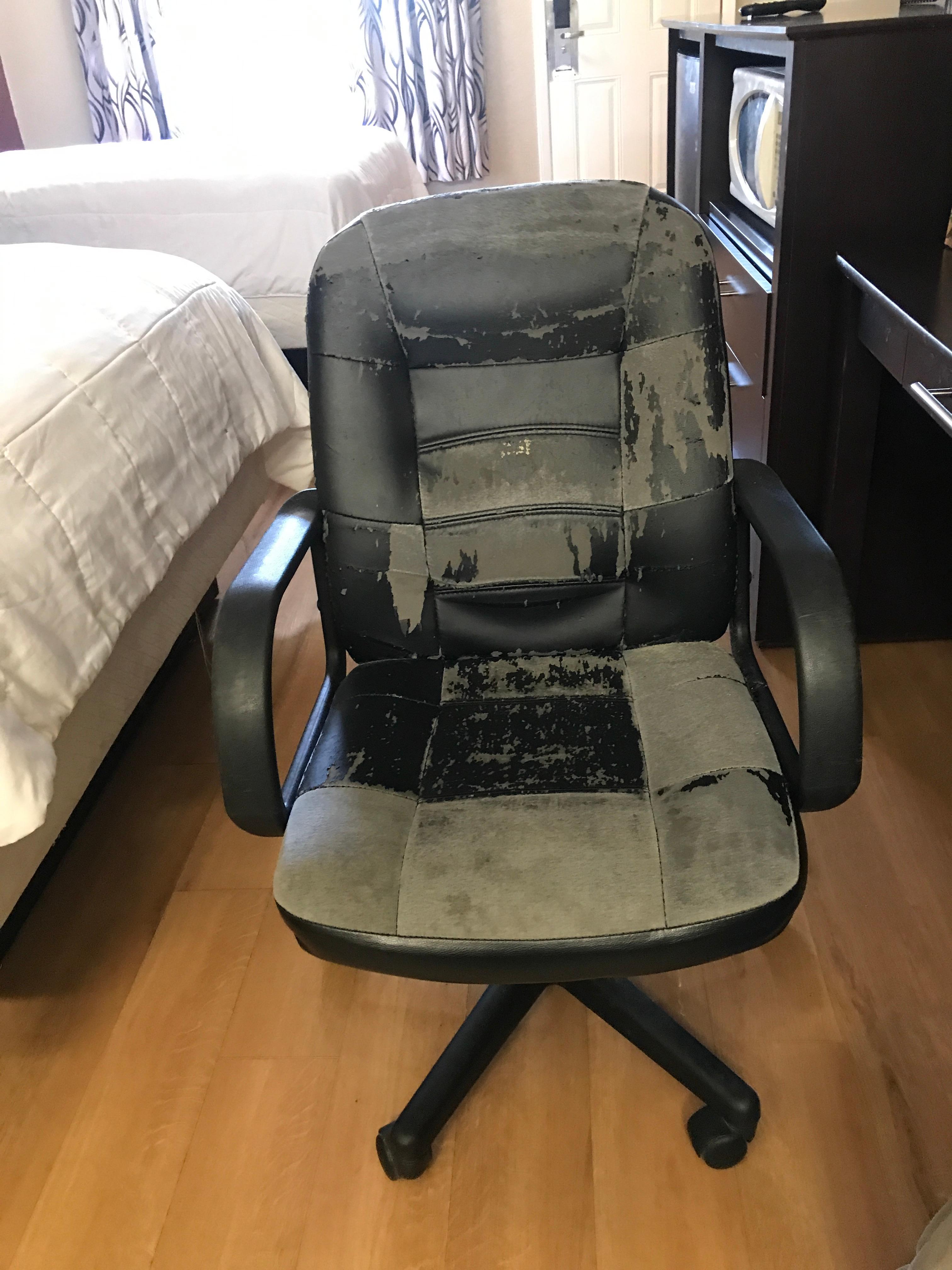 Disgusting super old chair with worn vinyl.