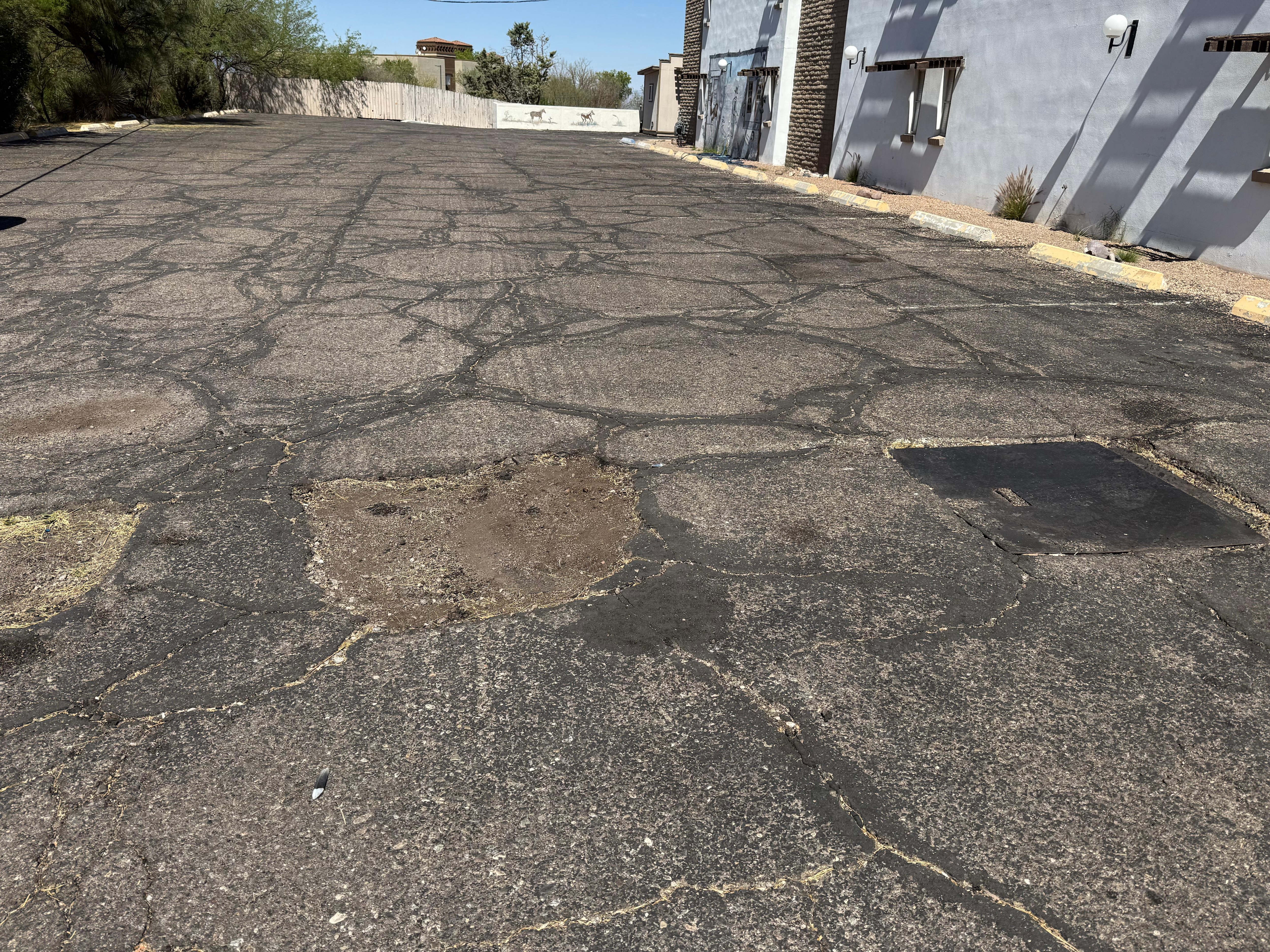 Parking Lot (uneven and not painted)