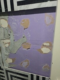 Missing tile in the bathroom. Directly in front of the toilet.