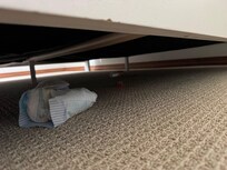 Soiled diaper under bed in one of the bedrooms.