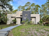 Front of property showing the steps and ramp