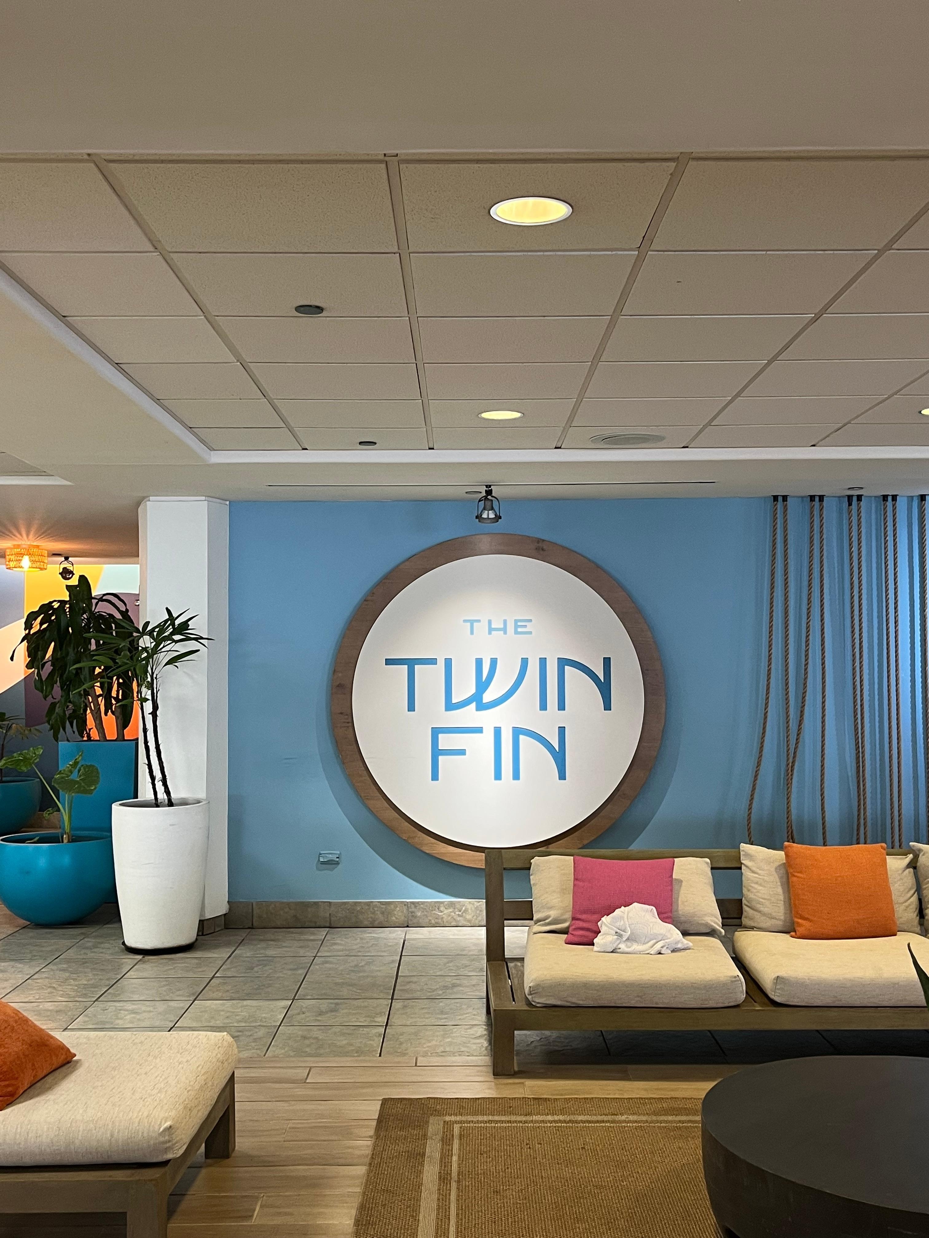 Reception area where there is also a car rental desk on site.