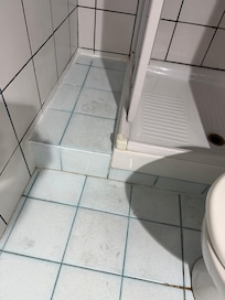 Floor is old and heavily stained.