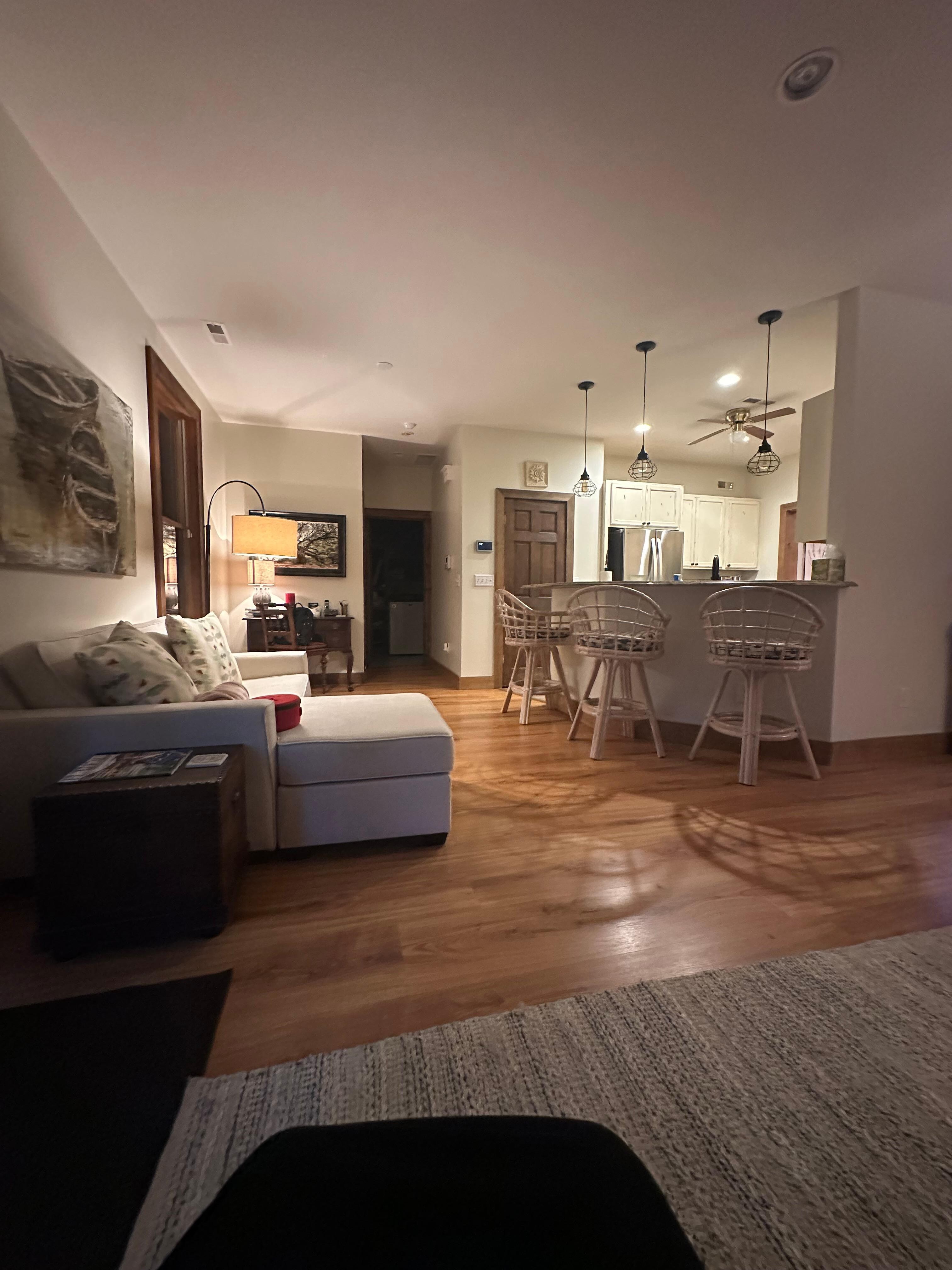 View toward kitchen.  You can see the love seat that had a chaise longue side…