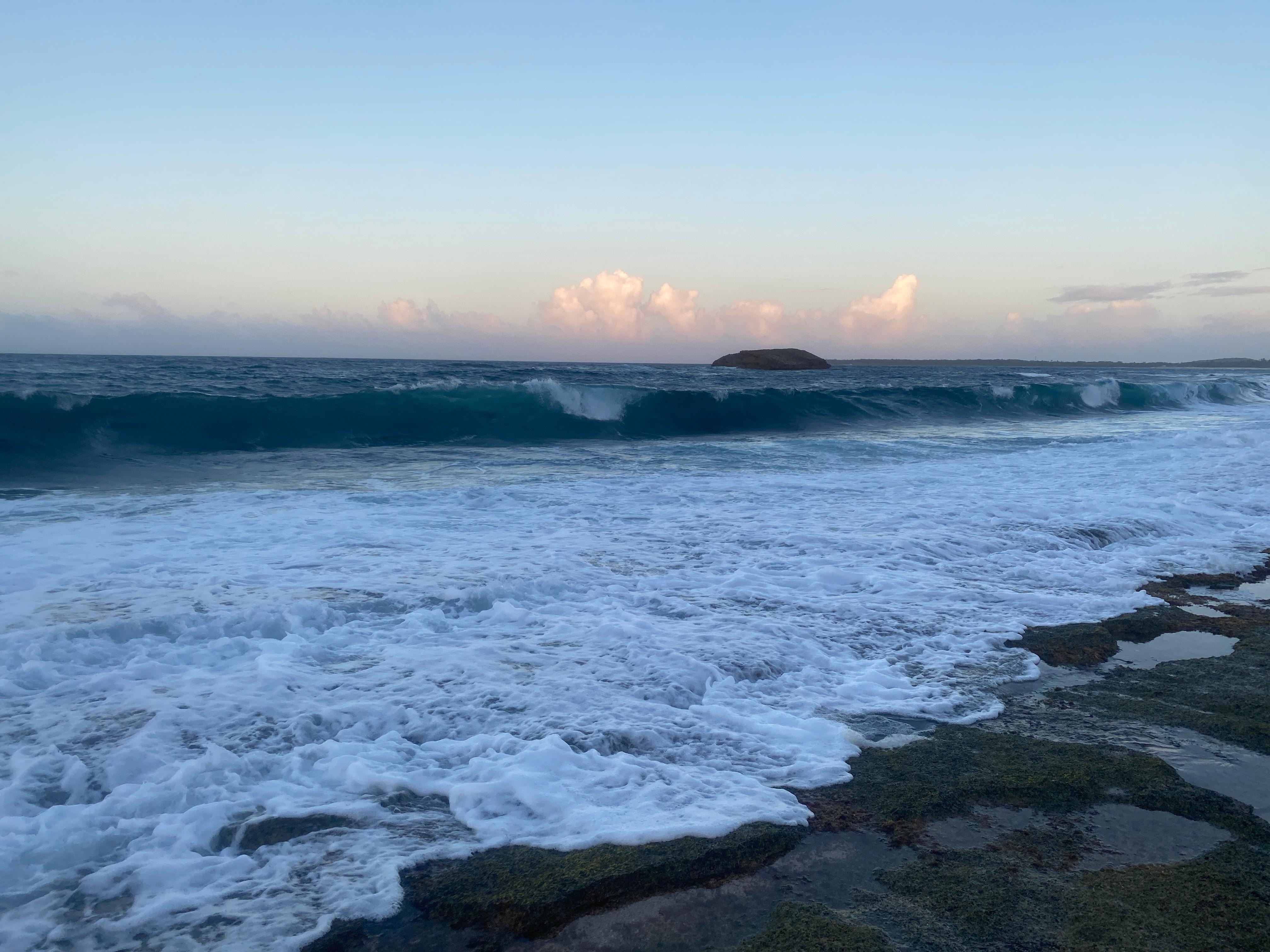 Exploring the beach at our unit in the evening. It is a bit rocky, best for exploring and finding seashells. 