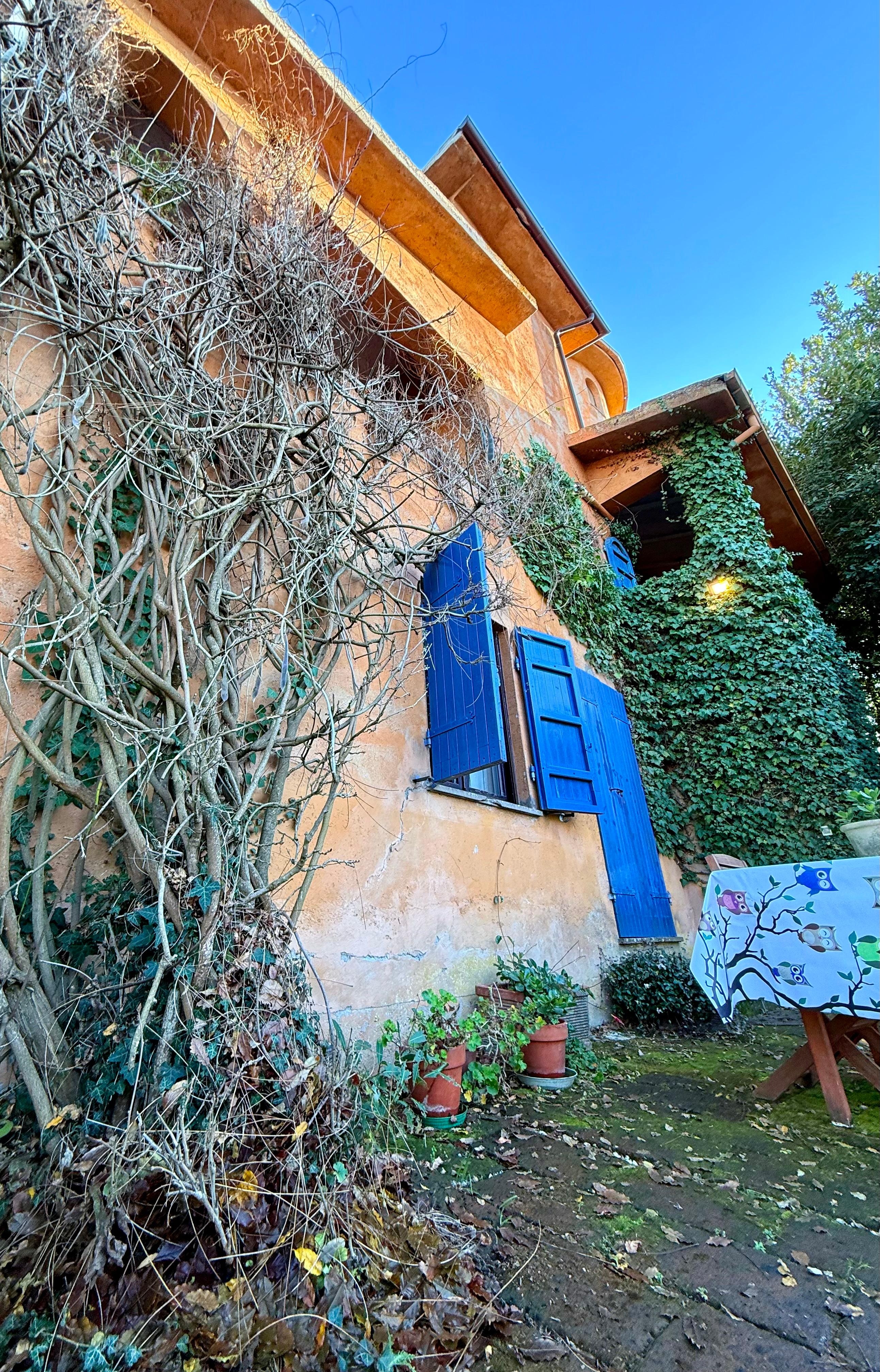 Love the character of of this villa, the blue shutters and doors and landscaping around the villa.
