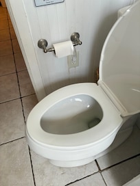 Possible urine stains around outlet next to toilet