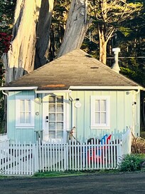 This is the Cypress Cottage. It has an enclosed area for our dog to go out quickly.