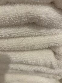 Long hair on bath towels under master sink