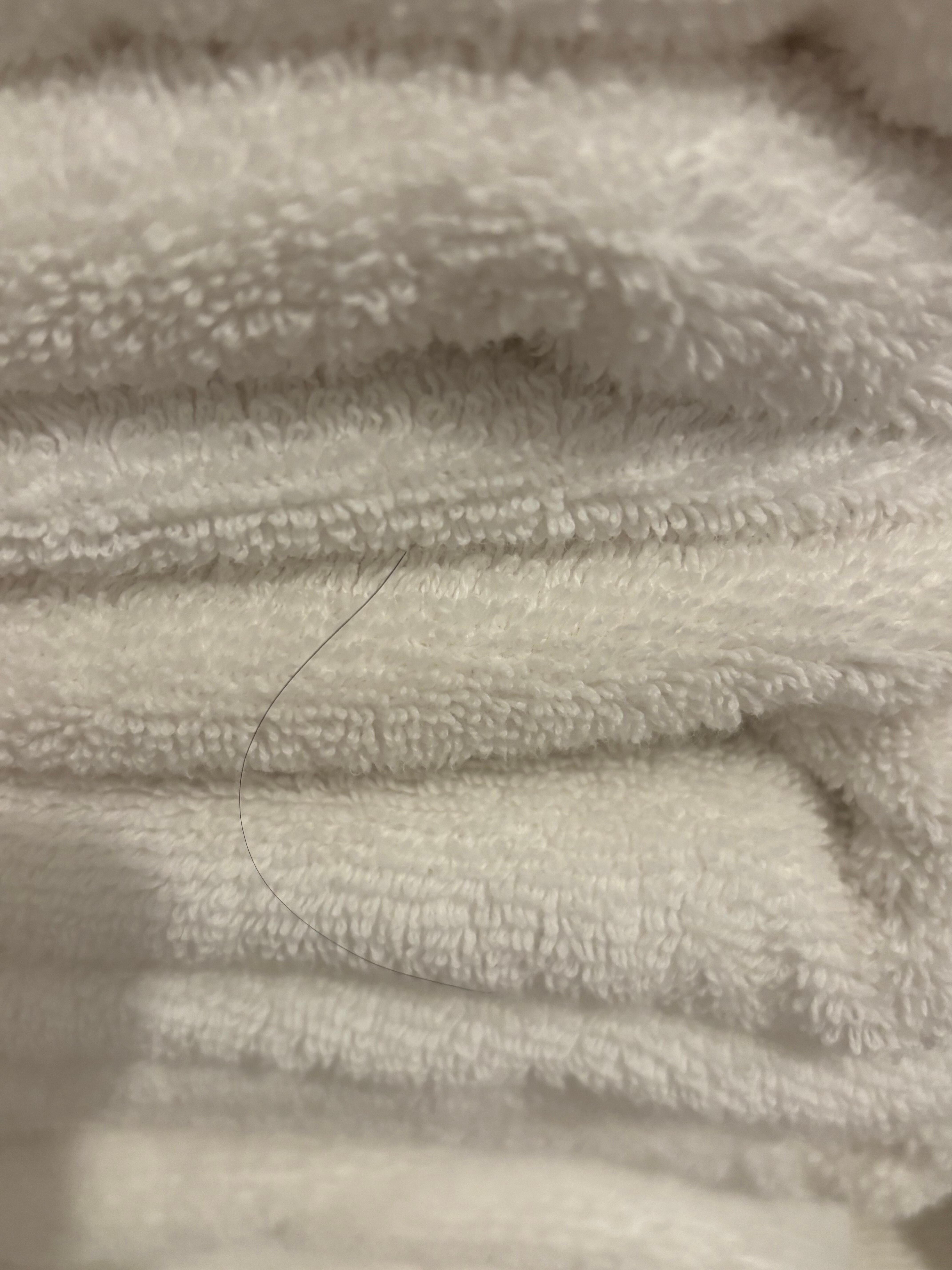 Long hair on bath towels under master sink