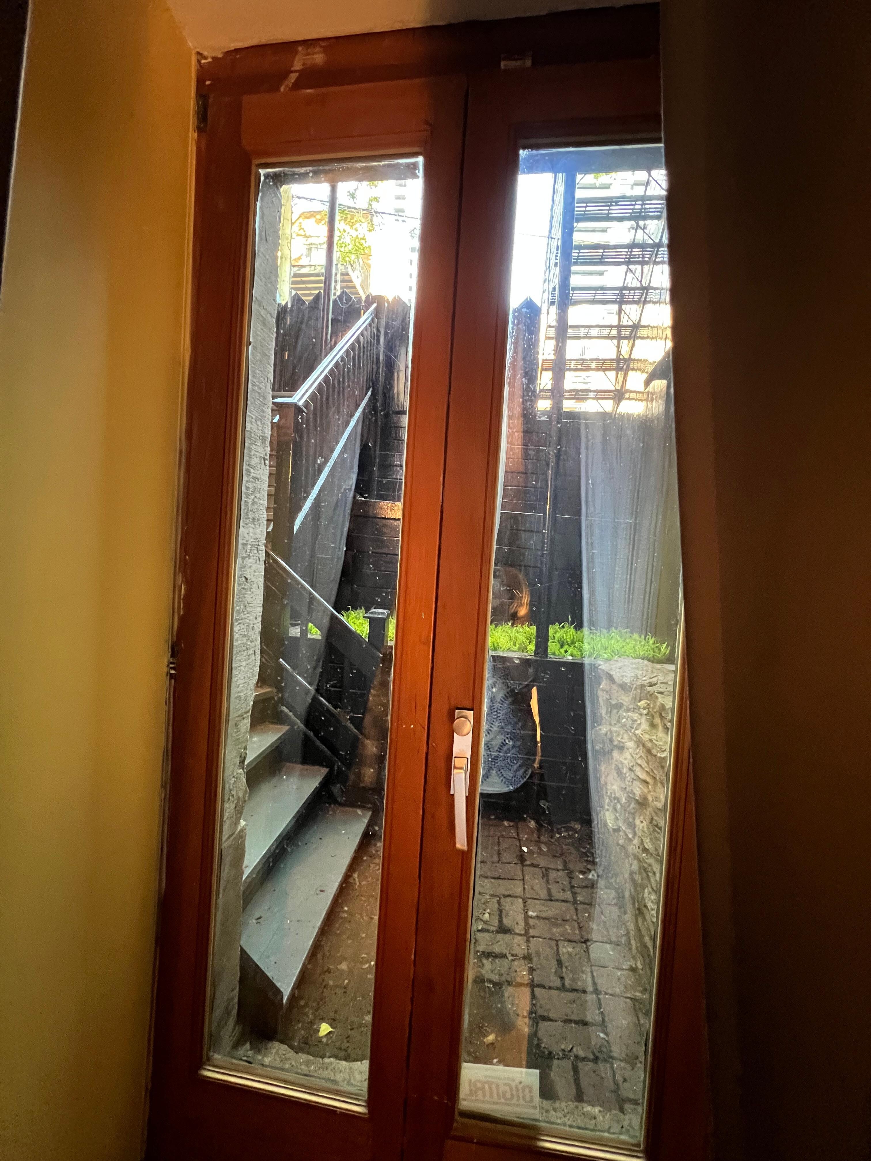 A glass door directly to the backyard and the street. Feel very undafe