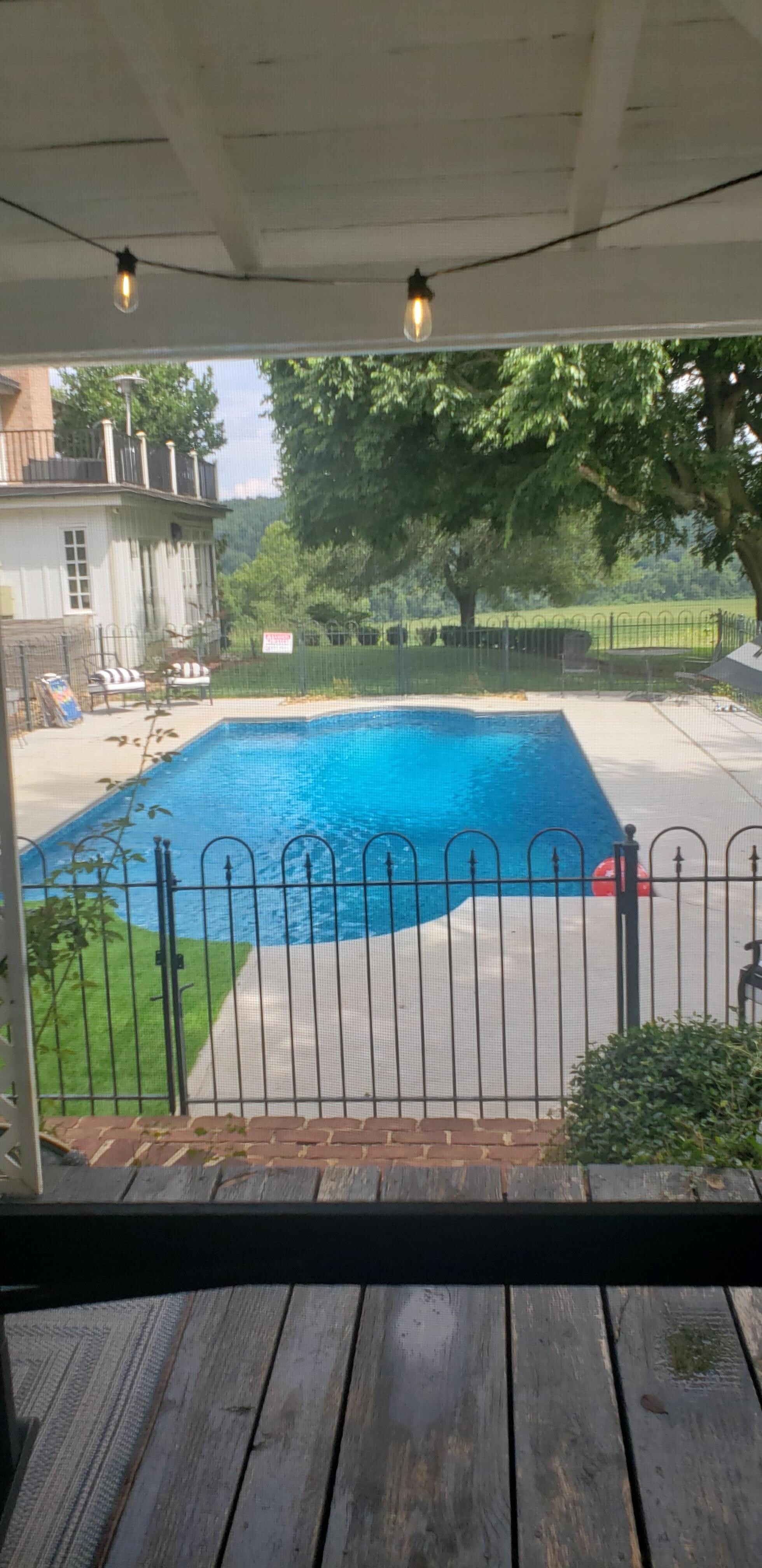 Pool view from the porch of the cottage.  