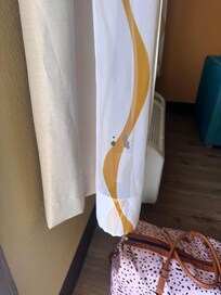 Curtains with cigarette burn holes