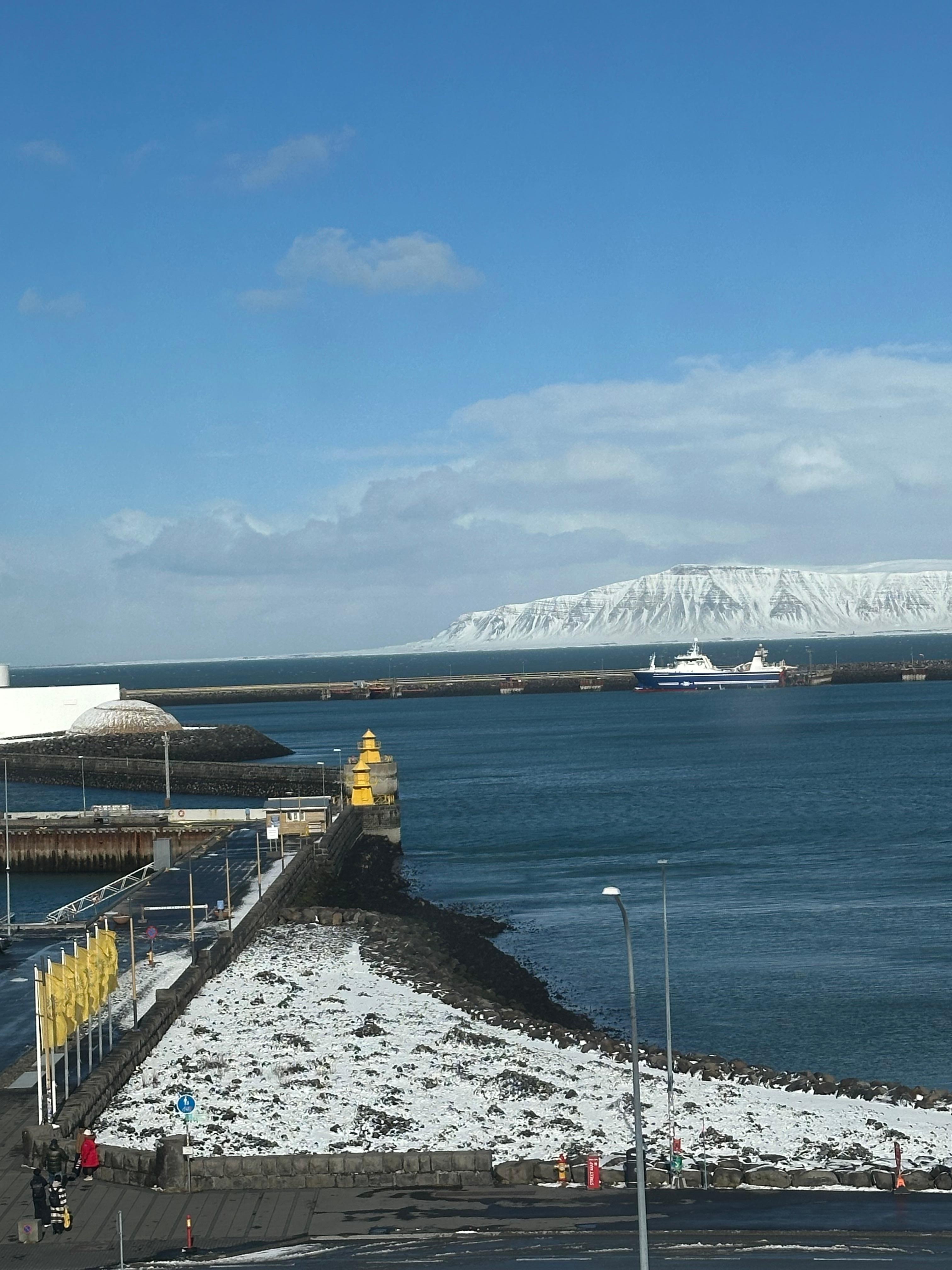 Morning view of icy cliffs across the bay. 