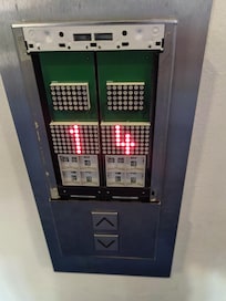 Broken cover for calling the elevator