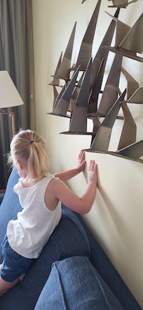 Sharp artwork that is dangerously close to our toddler's height