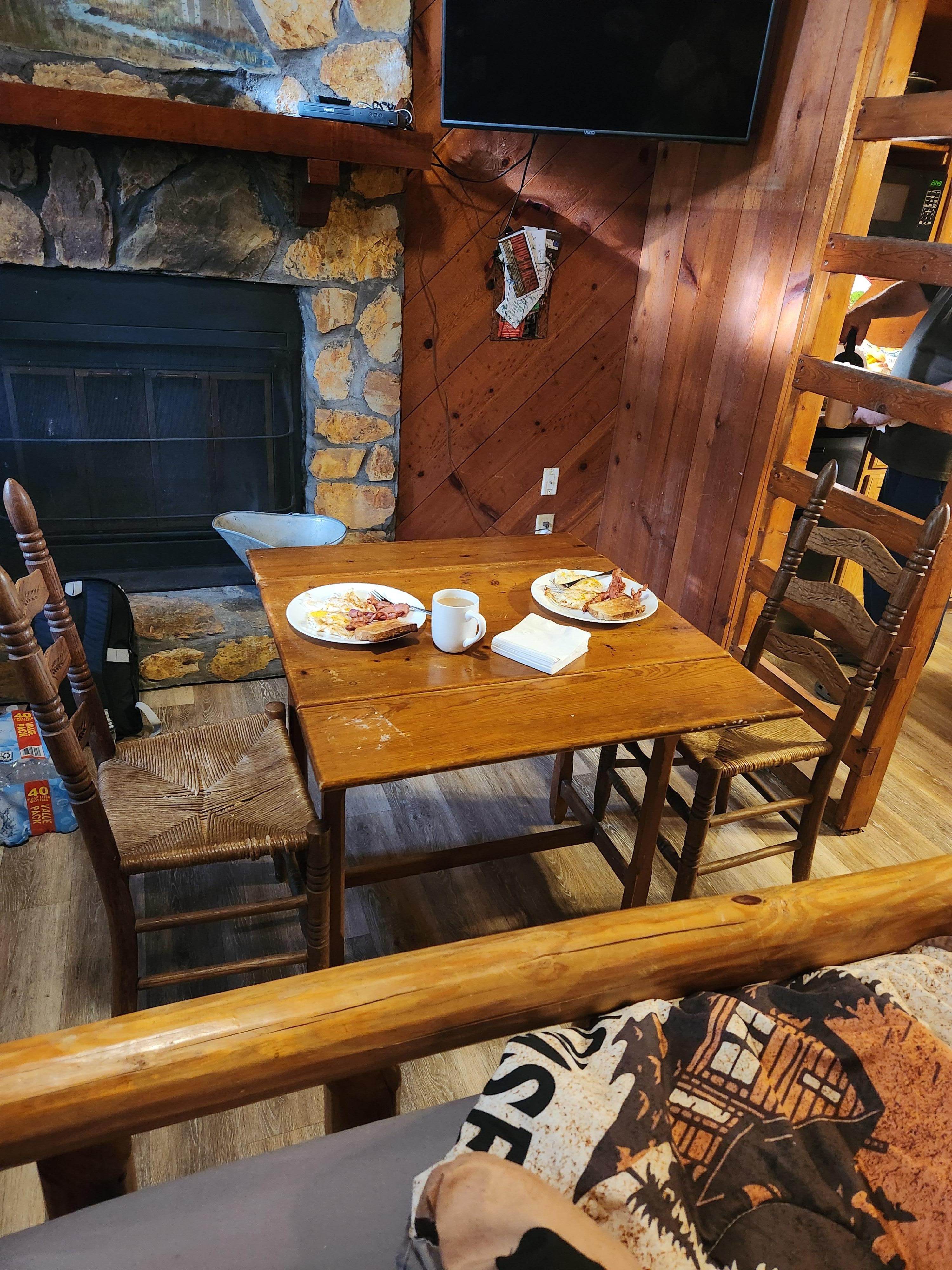 Having a meal with the side table that turns into a nice kitchenette table. It had 2 very comfortable chairs.