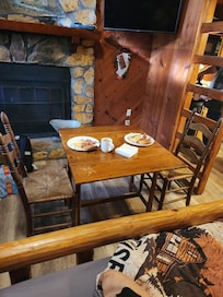 Having a meal with the side table that turns into a nice kitchenette table. It had 2 very comfortable chairs.
