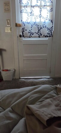 Gap under door from inside the room. Also there were nailheads sticking out from the edge of the shower.