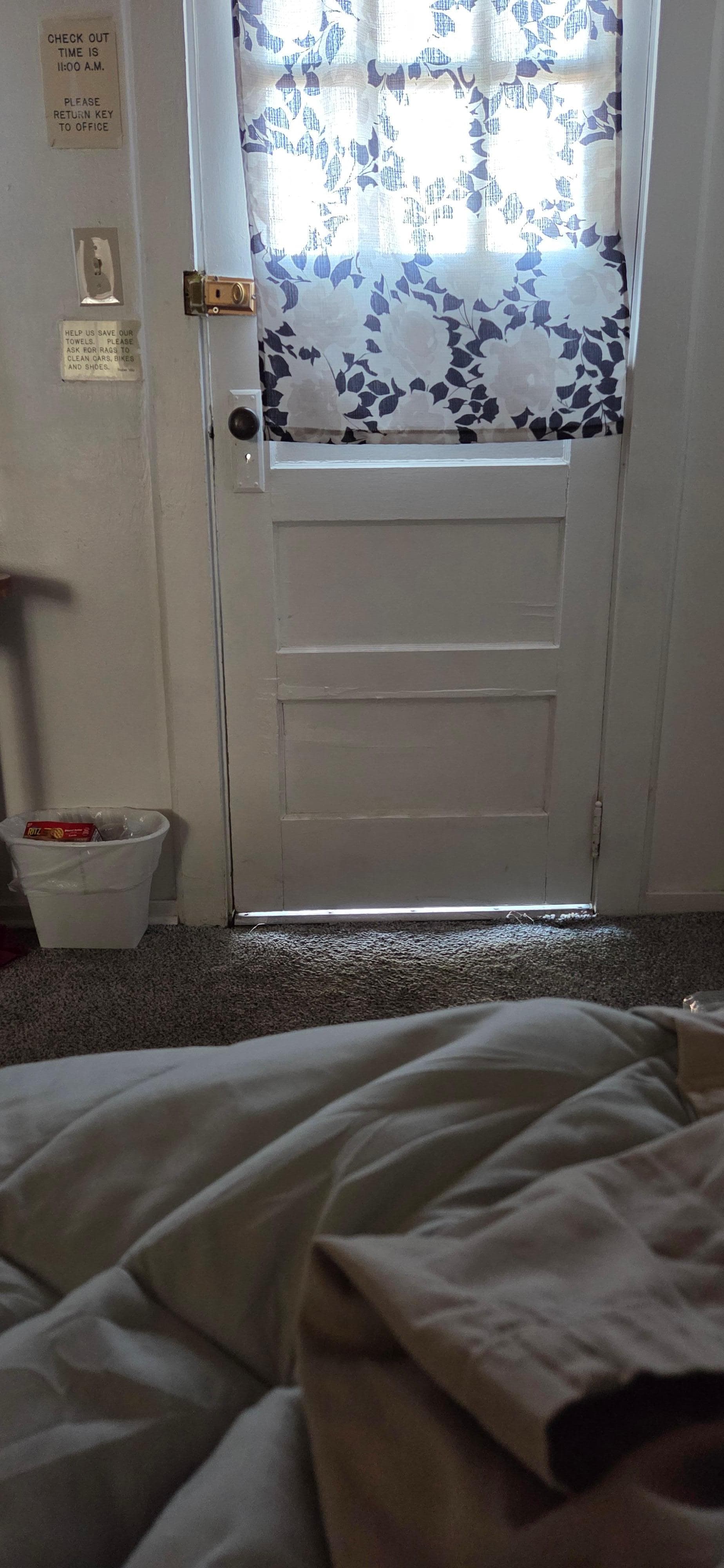 Gap under door from inside the room. Also there were nailheads sticking out from the edge of the shower.