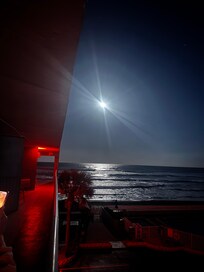 View of the full moon over the ocean from our balcony.