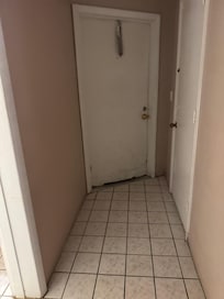 Room entrance door, dirty scuffed, rusty