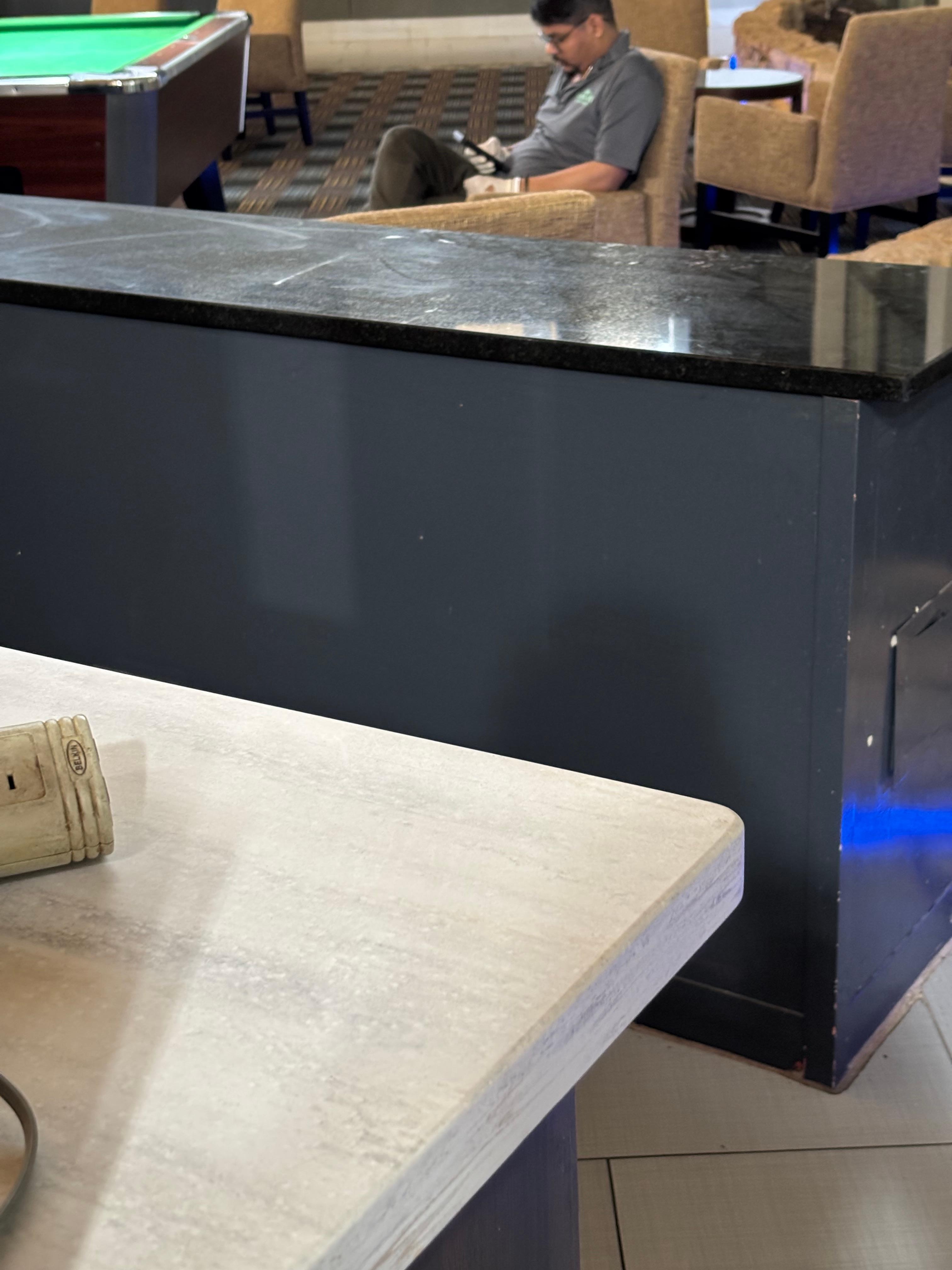 He handles the food with the same gloves he’s using for his phone 