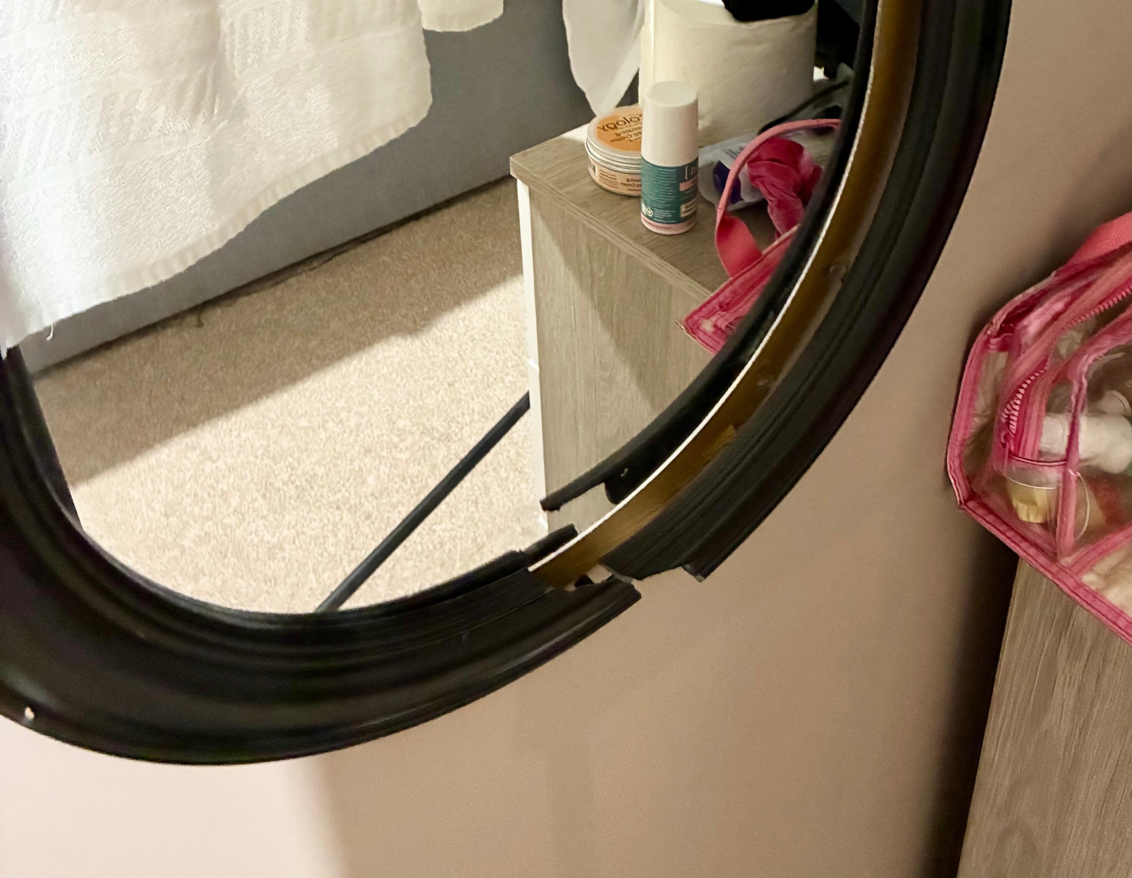 Mirror with broken frame.