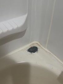 Black burn on shower