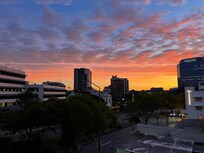 Sunrise view from the porch, facing nearby Toowong Village shops.