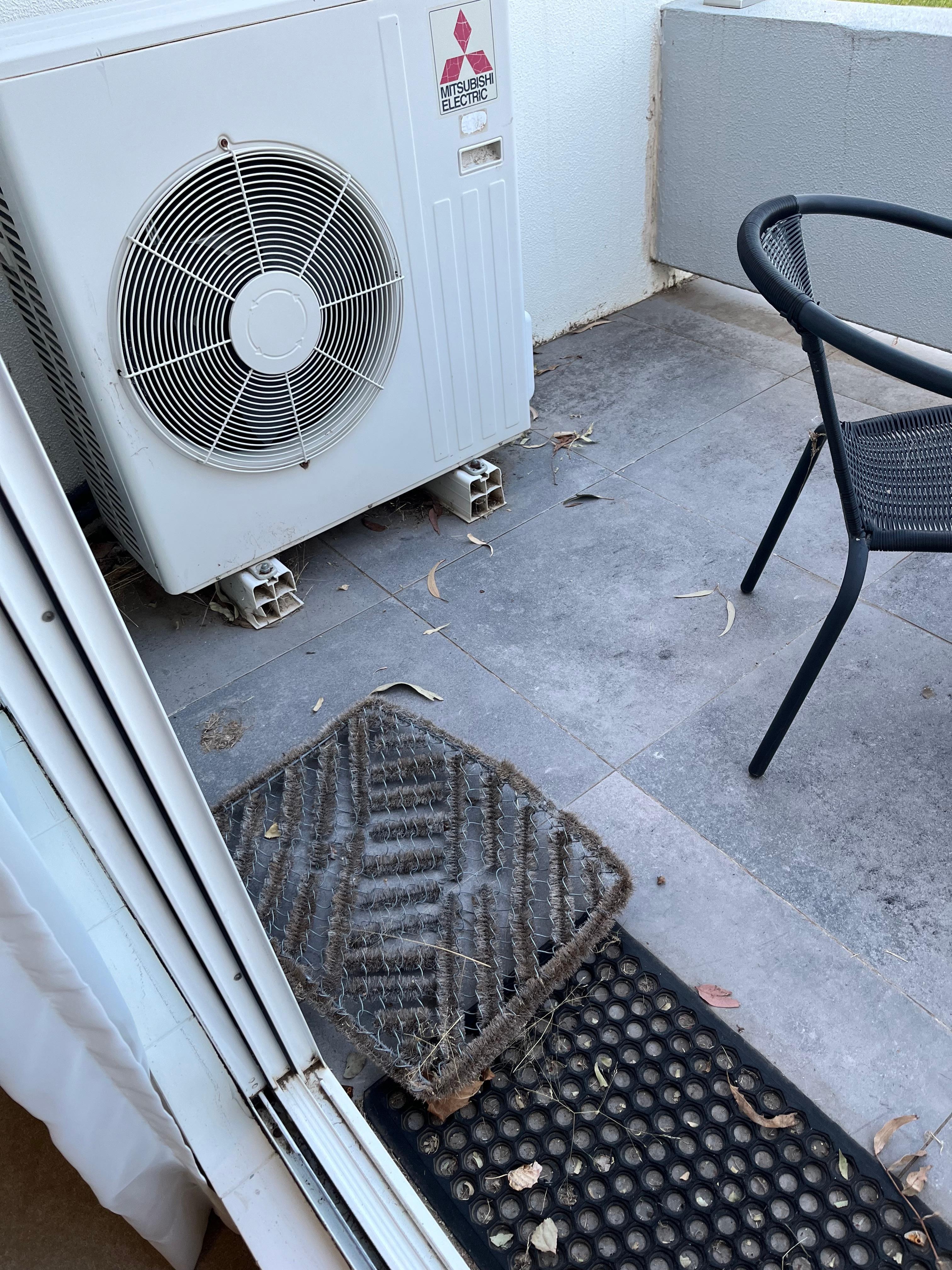 Dirty balcony with old door mats 