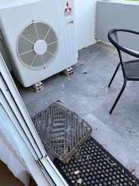 Dirty balcony with old door mats