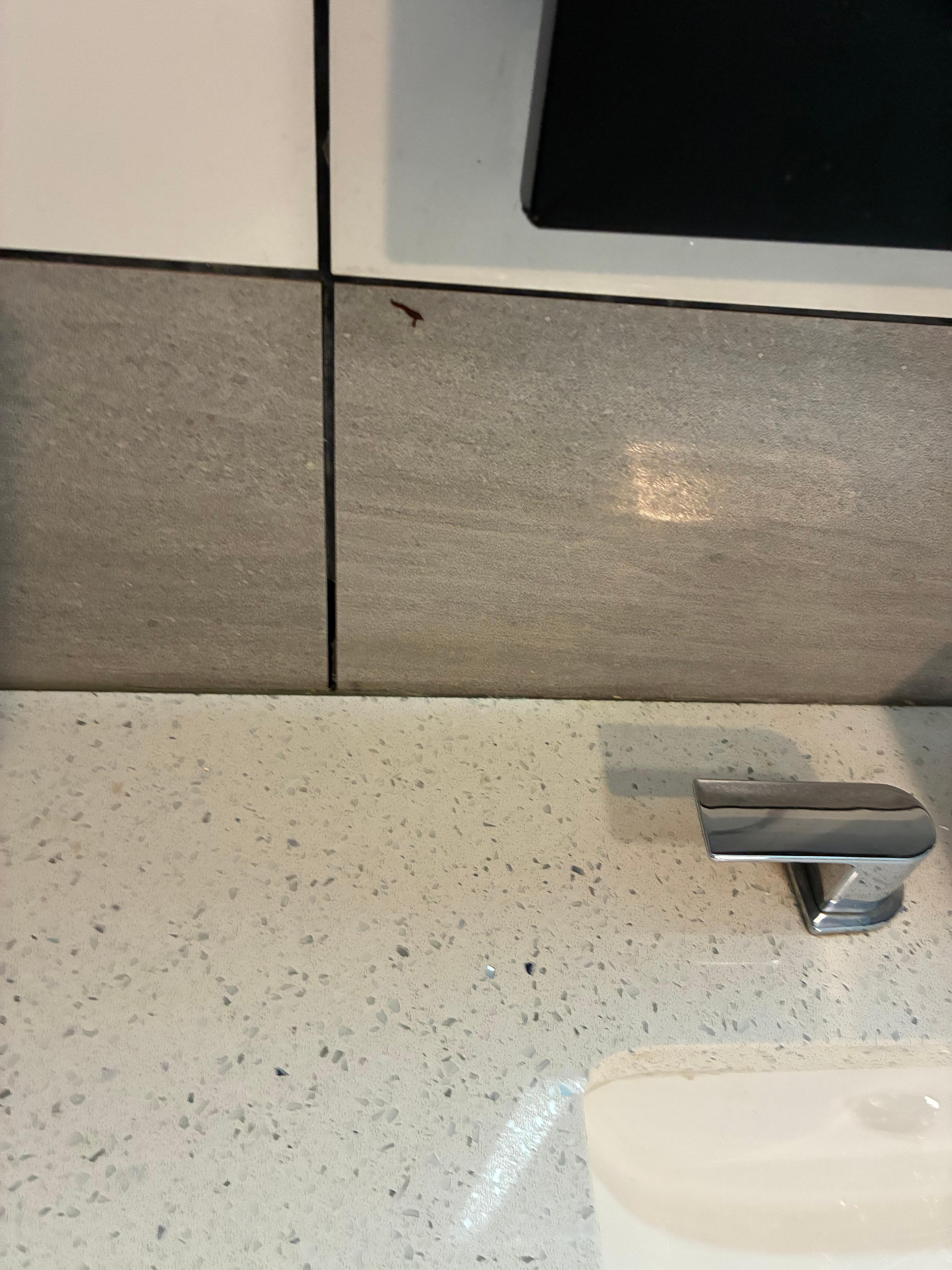 Stuff on the walls next to the mirror 