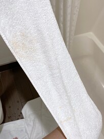 Dirty towels in the bathroom which also included other people trash in the bin.