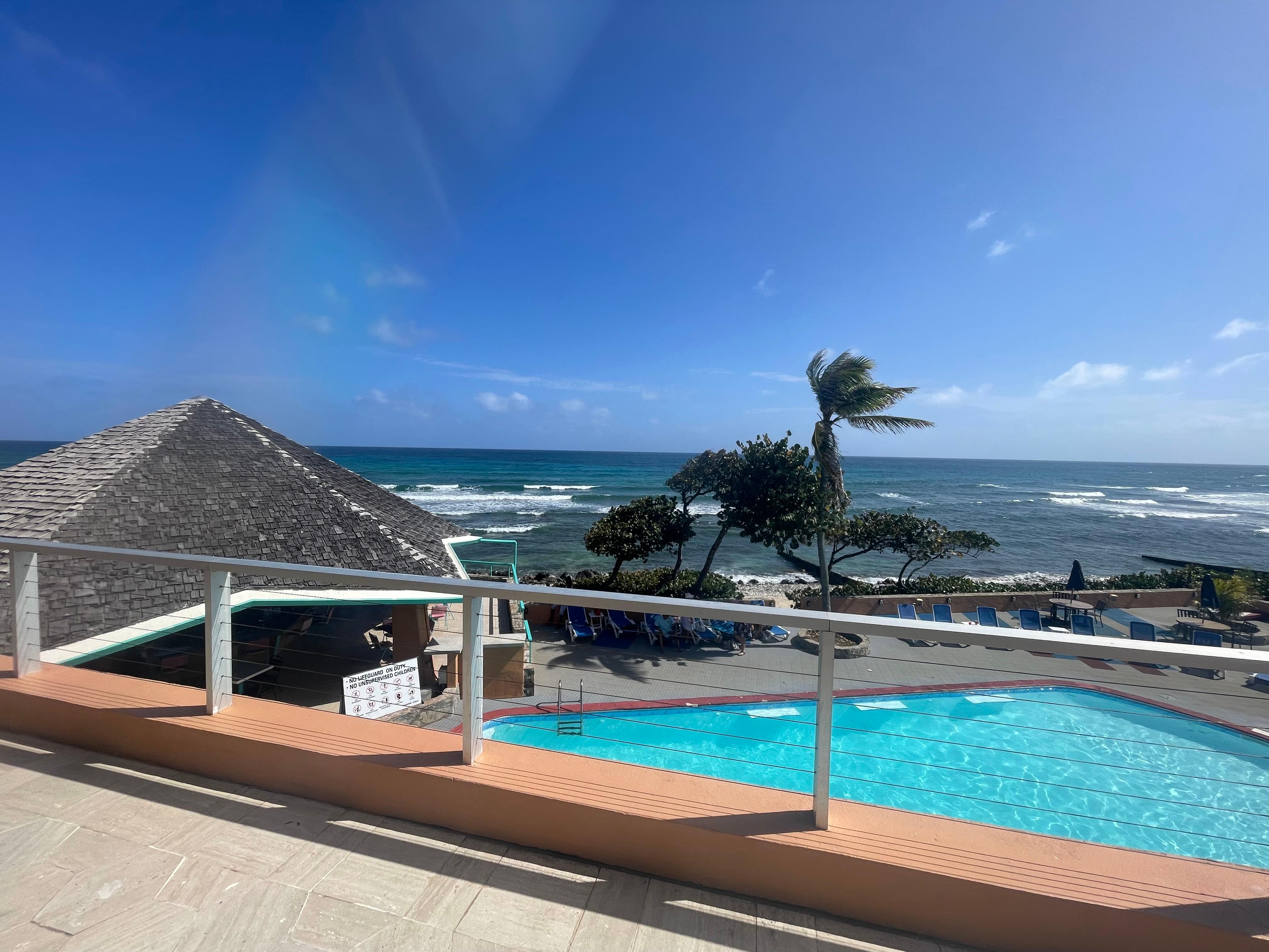 The pool overlooks the ocean