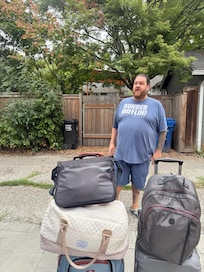 Guest waiting for the Uber, outside with half of our luggage.