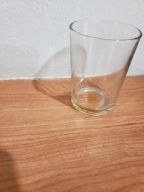 Ants crawling all over counter and drinking glasses.