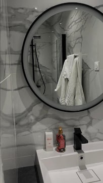 Bathroom #3 located in the master bedroom. Shower and sink only.