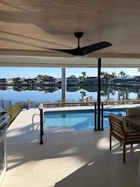 Heated backyard pool over looking the dock.