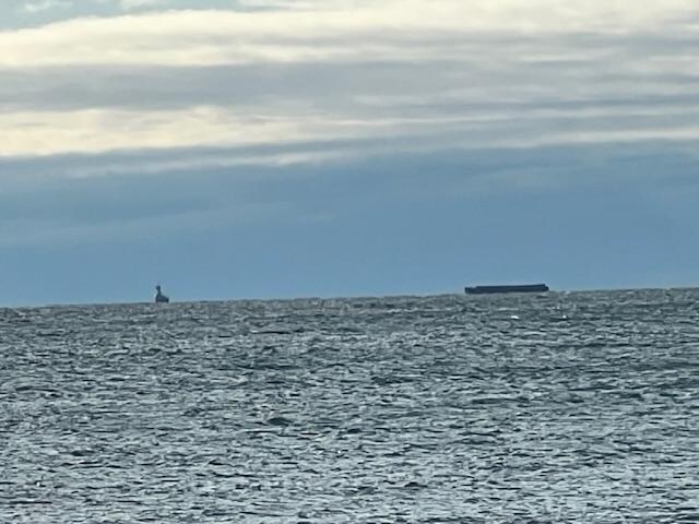Tugboat pulling a Flatbed
