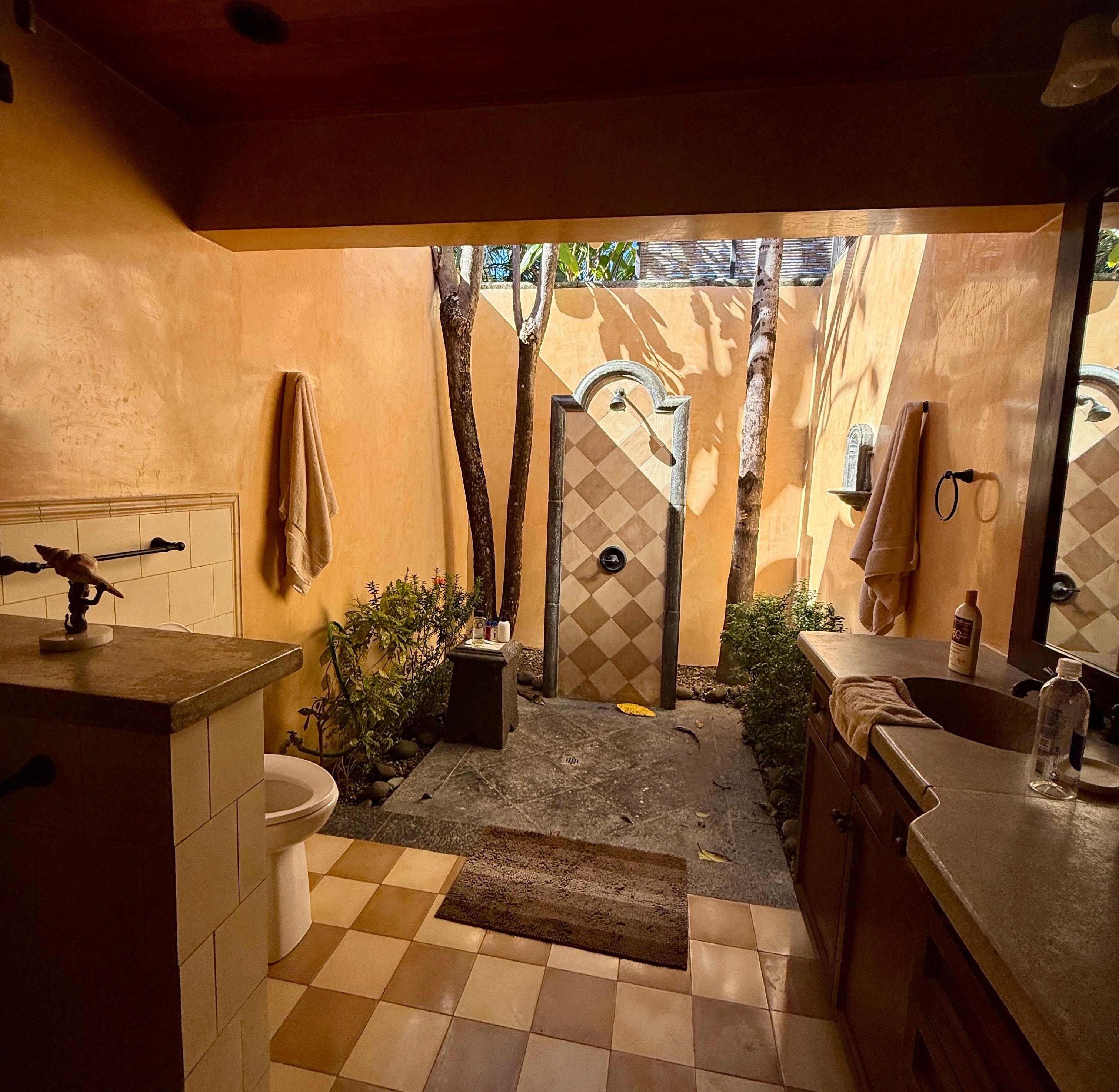 Cool outdoor showers in each bathroom