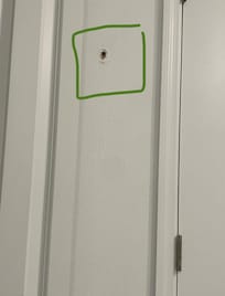 Holes in walls in bathrooms.